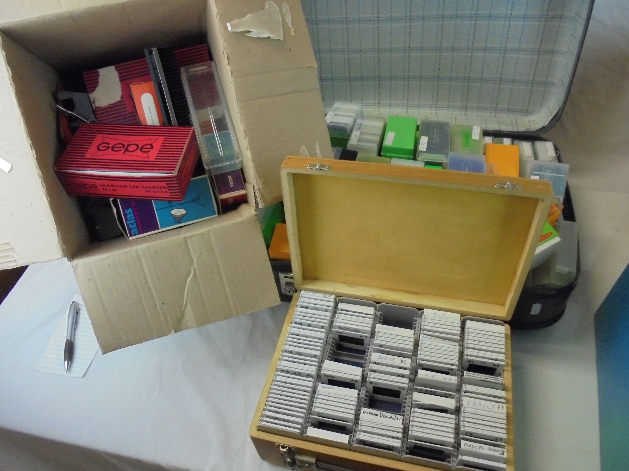 A large quantity of slides contained in three boxes plus one other cased set .and a suitcase of - Image 2 of 5
