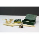 Collection of antique sewing items to include Ivory clamps, needle case and a pair of glove