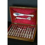 An oak cased cutlery set of fish knives forks and servers makers SB & CO Sheffield.