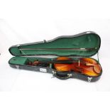 A cased students violin and bow.