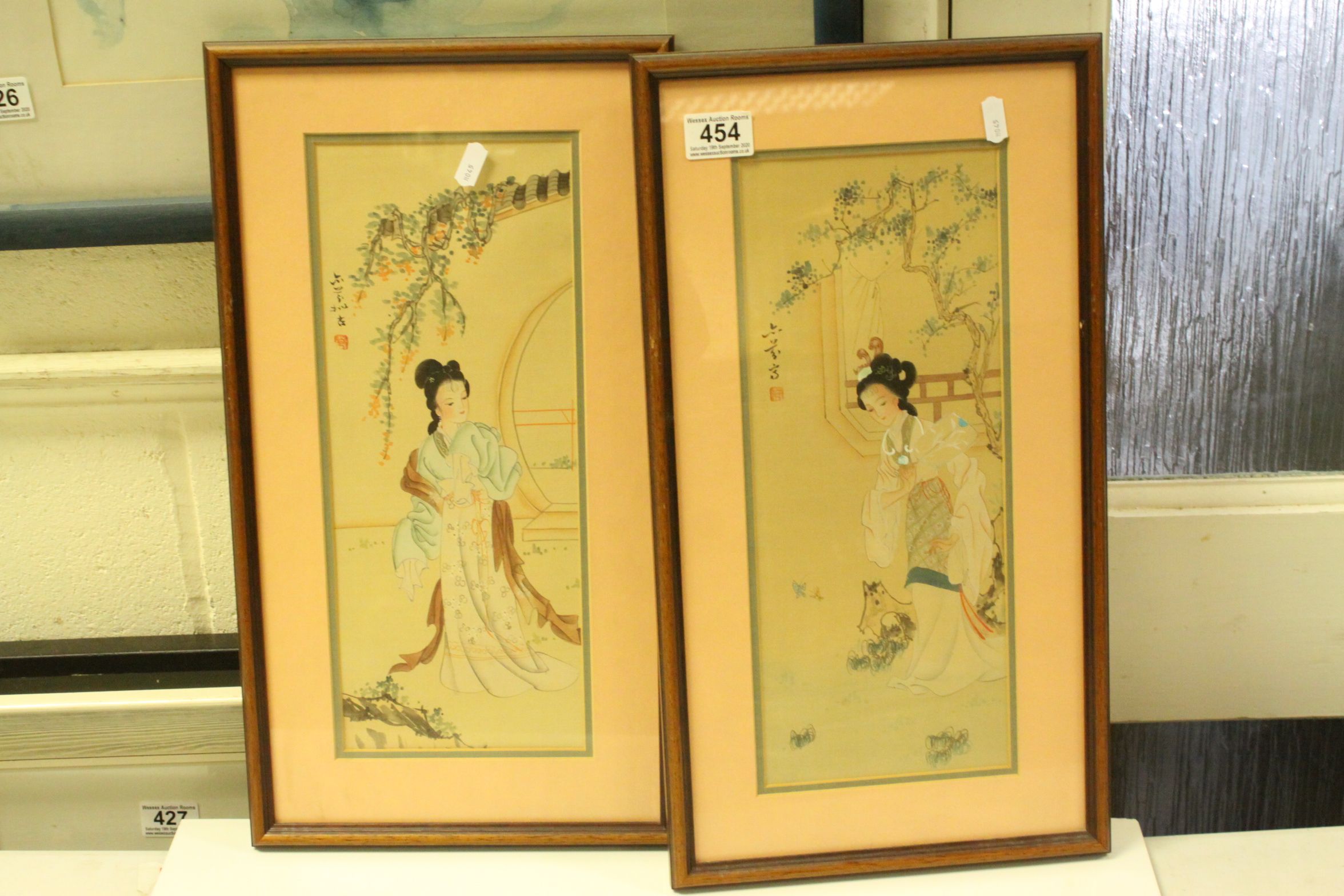 Pair of Oriental Pictures of Ladies in a Garden Setting, 37cms x 14cms, framed and glazed