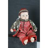 Chinese Bisque Head Doll dressed in traditional clothing