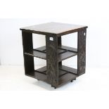 Early 20th century Oak Revolving Bookcase, each side carved with a heraldic style animal, 49cms wide