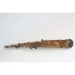 A 19th century antique folk art walking stick the handle in the form of man in cap