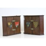 Pair of Small Wooden Corner Cupboard, each with two doors painted with crests, 26cms high