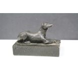A bronzed figure of a hound dog marked W,M. Pierce to the base.
