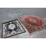 Red Ground Modern Rug and Two Blue Ground Modern Rugs