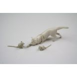 An early 20th century miniature carved cat and mice figures.