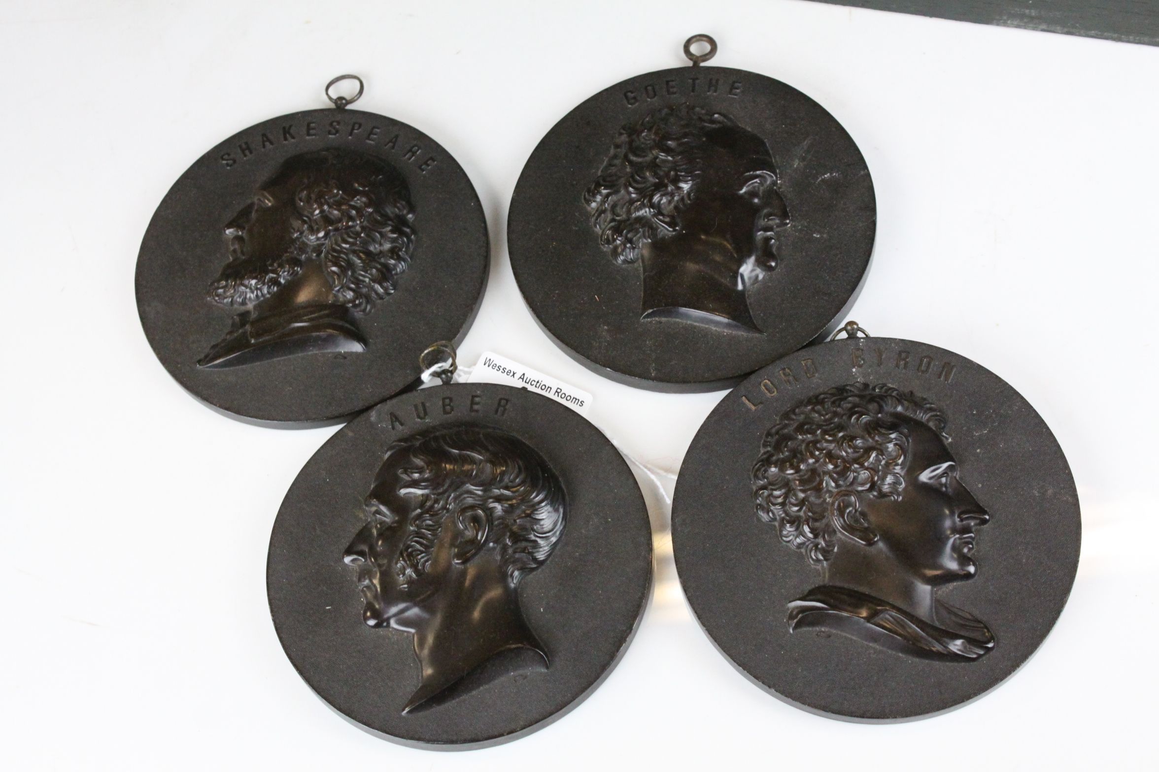Four Bois Durci Circular Plaques - Lord Byron, Auber, Goethe and Shakespeare - each 11.5cms