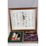 A framed set of fly fishing flies together with a large quantity of similar in a case.