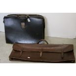 A black leather briefcase together with one other leather bag.