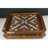 A Luxury Edition scrabble set with gold coloured letters missing one piece