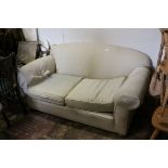Late 19th / Early 20th century Drop-End Two Seater Sofa upholstered in cream fabric, 160cms long