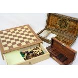 A collection of three games to include Chess, Draughts, Dominoes and Backgammon all complete in