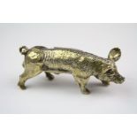 A vintage miniture brass pig figure.