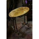 Victorian Walnut Oval Top Side Table with fretwork apron, raised on turned legs united by a cross-