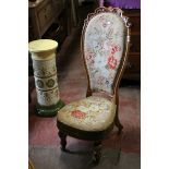 Victorian Walnut Nursing Chair with ornate carved top rail and floral needlework upholstered back