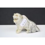 An oriental carved soapstone tiger. Approx 55mm in height.