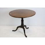 George III Mahogany Circular Tilt Top Table with Bird Cage action raised on a pedestal support