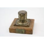 Miniature Brass Capstan made from the brass of H.M.S Jutland mounted on a wooden plinth, 6.5cms