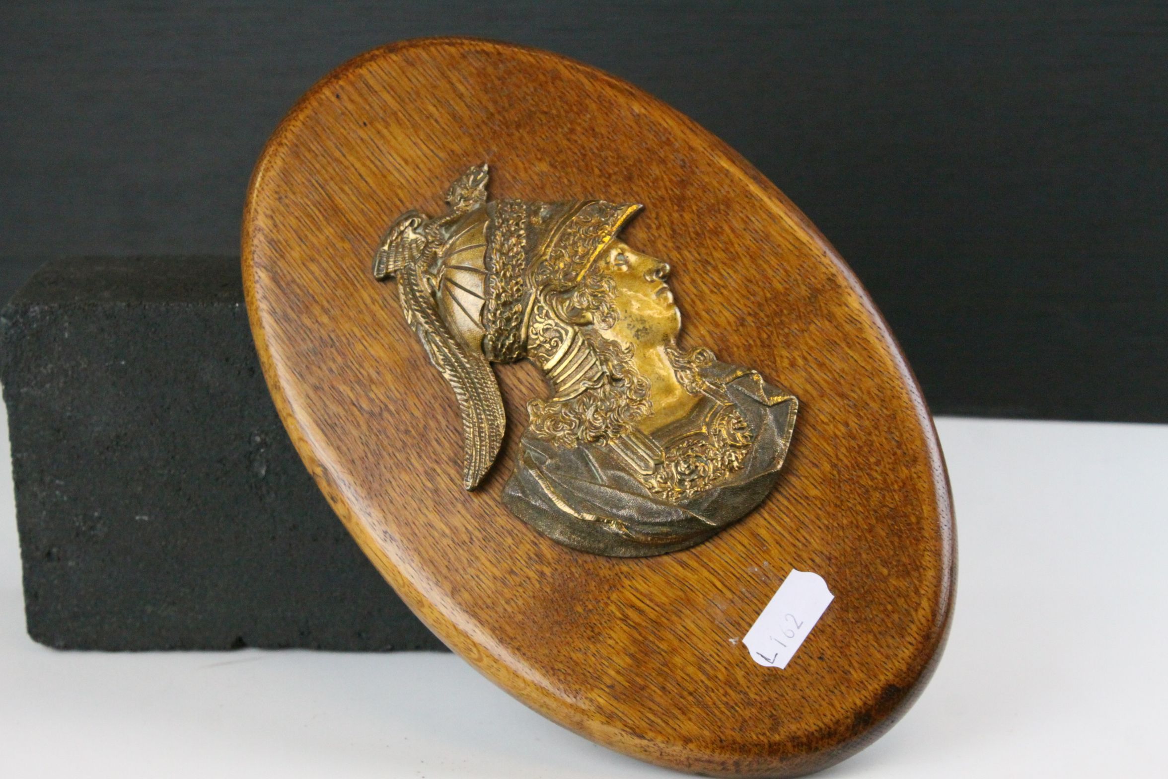 Pair of Oak Oval Wall Plaques mounted with Brass Side Profiles of Romans, 23cms high - Image 3 of 4