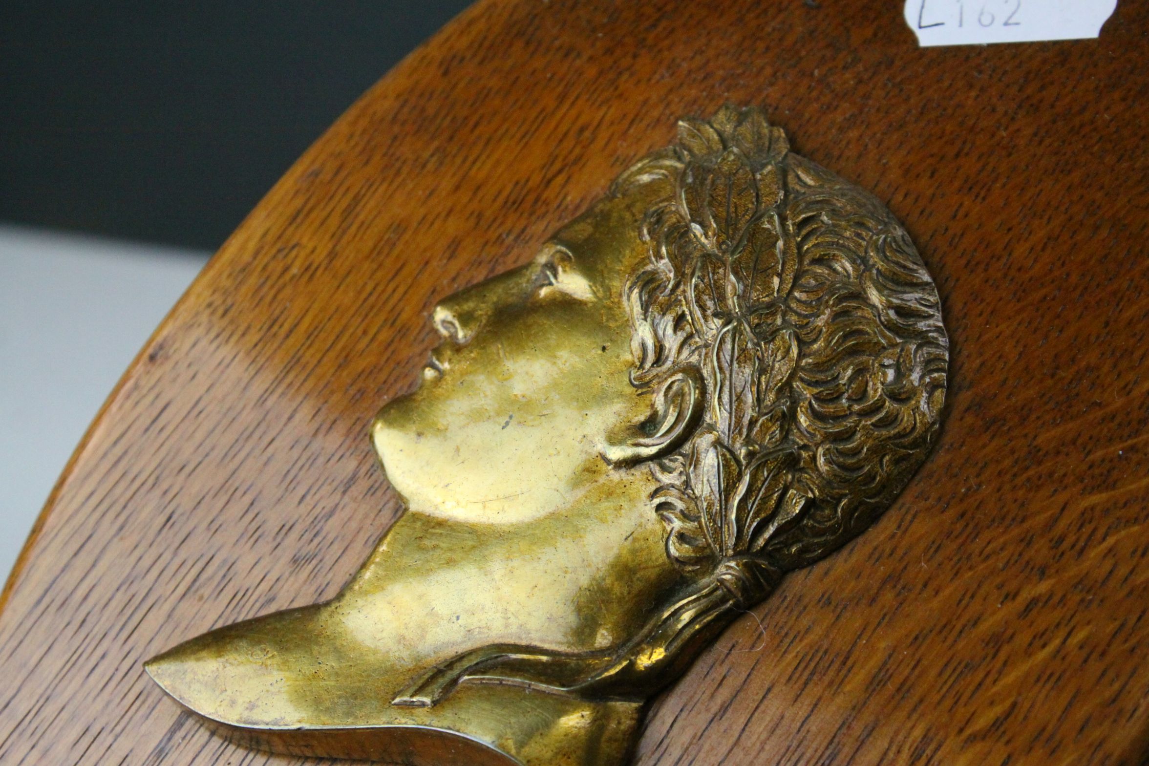 Pair of Oak Oval Wall Plaques mounted with Brass Side Profiles of Romans, 23cms high - Image 4 of 4