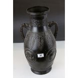 Large Chinese Bronze Vase with Twin Dragon Mask Handles and decorated with four roundels depicting