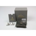 A pair of white metal Vivienne Westwood earrings complete with original box.