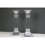 A pair of Waterford Crystal candlesticks signed. 8 inchs in height and a Pair of Waterford Cruets
