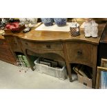 George III style mahogany and crossbanded serpentine sideboard, 19th century, on square tapering