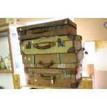 Three Vintage Leather Suitcases together with a Canvas Suitcase