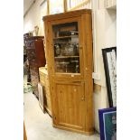 Large 19th century Pine Corner Cabinet, the upper section with glazed door opening to reveal two