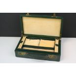 A vintage green two tier jewellery box complete with key.