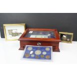 A cased set of Danbury Mint Queen Elizabeth II Commemorative coins and banknote complete with COA.