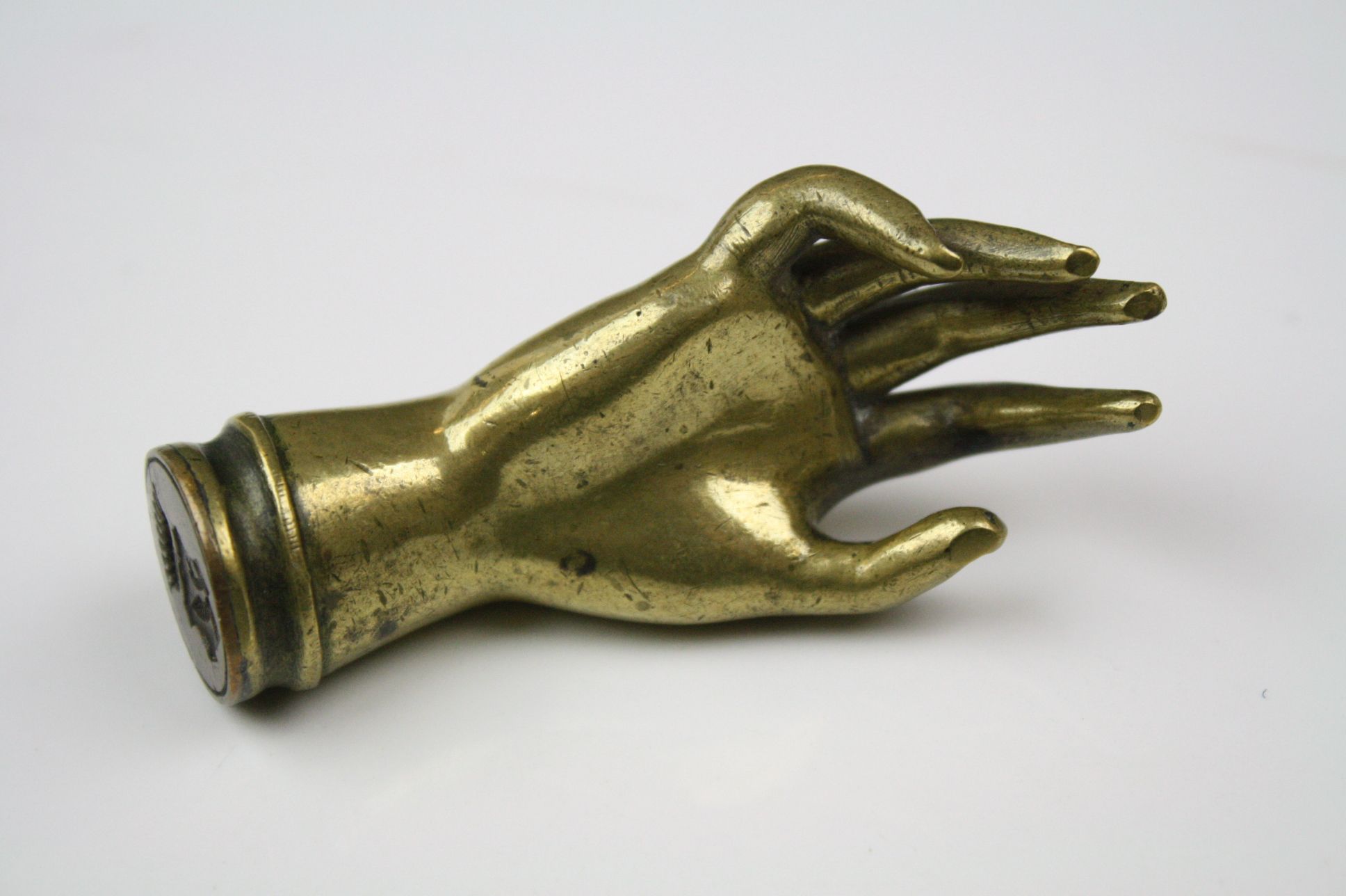 An antique brass wax seal in the form of a hand. - Image 2 of 3