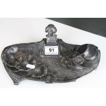 Art Nouveau Pewter Standish with a single inkwell compartment and applied Maiden's Head, 29cms long