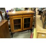 Early 20th century Mixed Wood Cabinet with a single long drawer above two glazed doors, 103cms