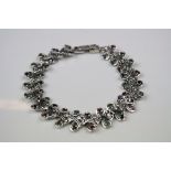 Silver linked Bracelet with ruby, emerald and sapphire cabochons