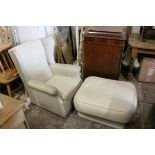 Wing Back Armchair and a Square Pouffe / Footstool upholstered in matching cream fabric