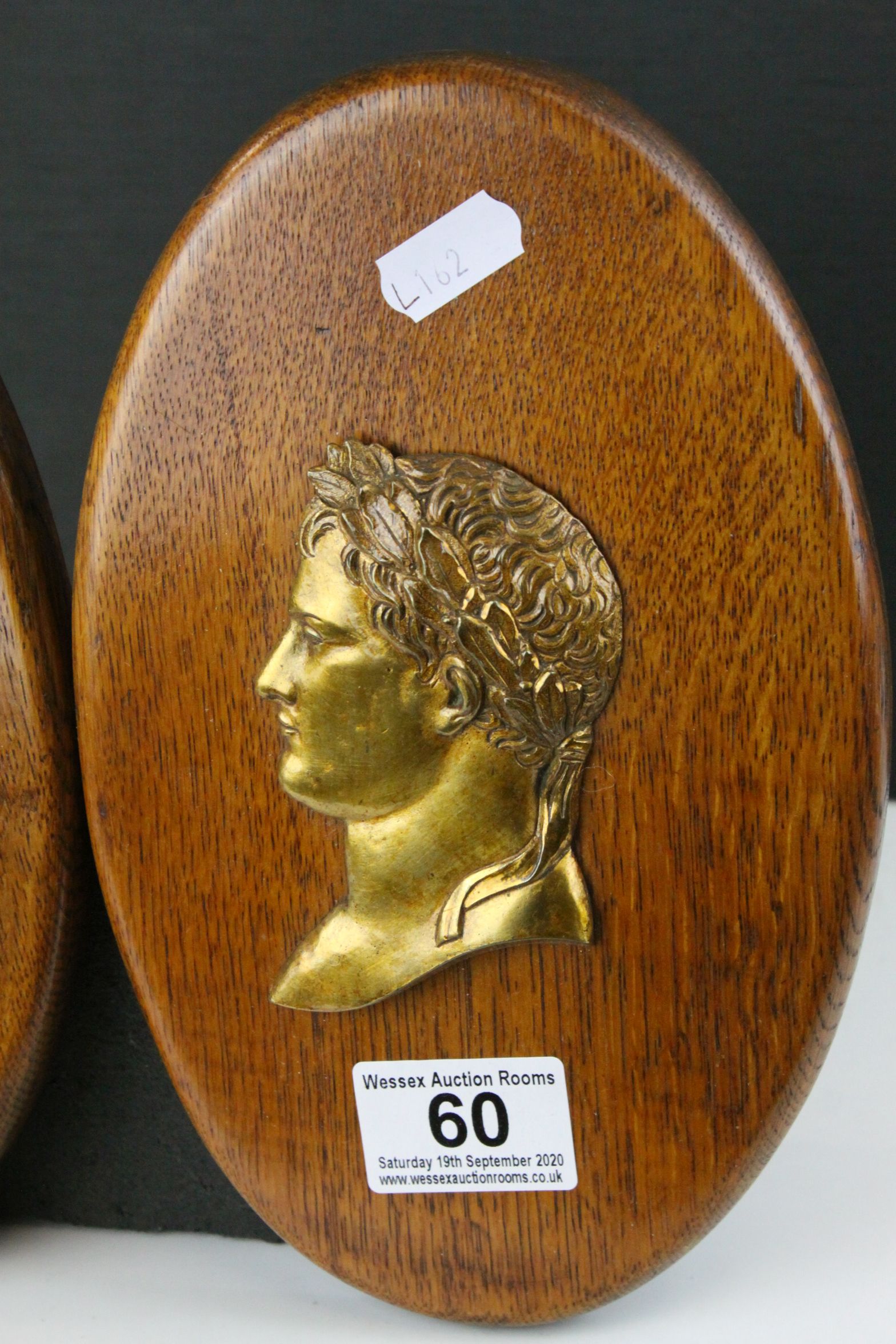 Pair of Oak Oval Wall Plaques mounted with Brass Side Profiles of Romans, 23cms high - Image 2 of 4