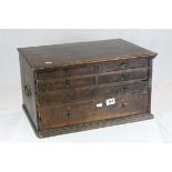 19th century Oak Tool Cabinet, the arrangement of seven drawers each with recessed brass handles,