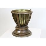 Early 20th century Plant Holder, the slatted sides holding a brass liner, the liner lifting to