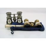 Two pair of vintage opera glasses to include a mother of pearl and brass example.