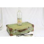 Vintage Canvas and Leather Suitcase together with an empty 6 pint Bottle of Mackinley's Old Scotch