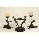 A trio of Art Deco style resin candle stands in the form of ladies together with a cut glass