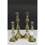 Two Pairs of Brass Candlesticks, tallest 28cms high with registration numbers