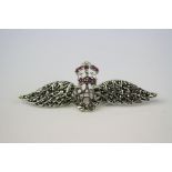 A silver and marcasite RAF wing brooch