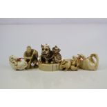Ivory netsuke of two rabbits, h :3 cm, another of a horse emerging from a bean pod, signed, l: