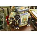 A contemporary ceramic elephant garden seat.