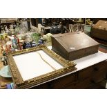 An antique gilt picture frame together with a table top oak writing slope.